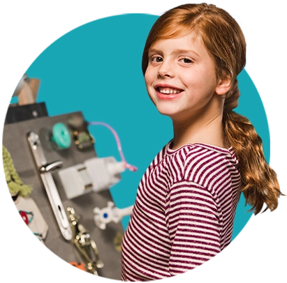 Child in Front of Blue Background